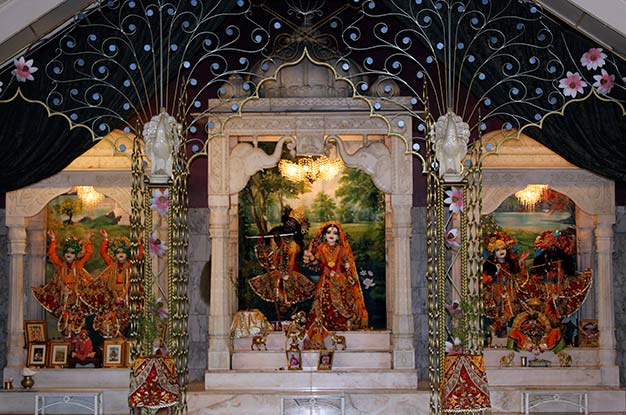 Sri-Sri Gaura-Nitai, Sri-Sri Radha Govardhana-dhari, Sri-Sri Krishna-Balarama, and Giriraj